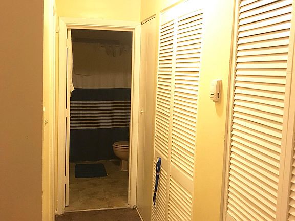 Hallway leading to bedroom and bathroom