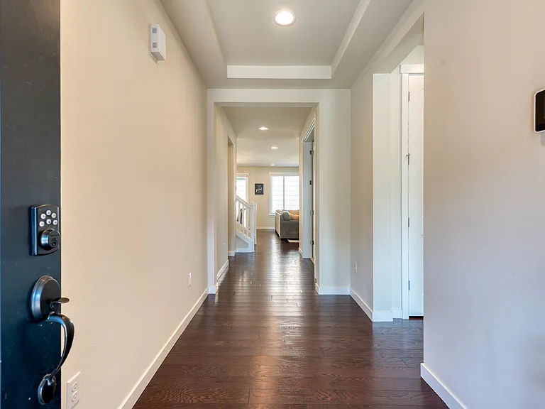 Entry area looking into the main hallway! High ceilings and LED lights