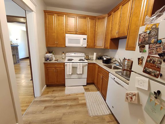 The kitchen features refrigerator, stove/oven, dishwasher and microwave, and plenty of cabinet space