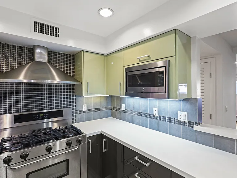 Kitchen with Stainless-Steel Stove and Microwave Oven