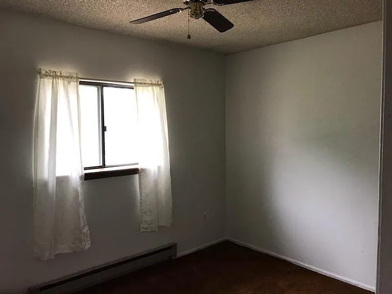Bedroom 2. Larger room and has a larger closet than bedroom 1.