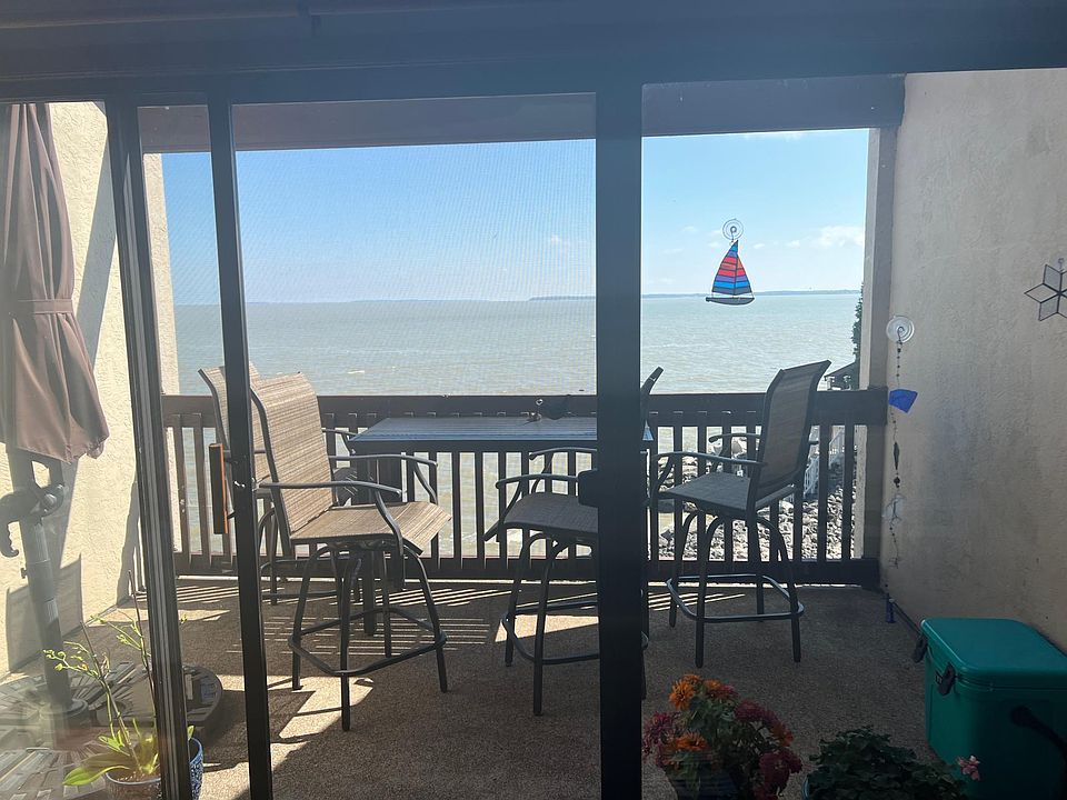Living room view of patio and lake