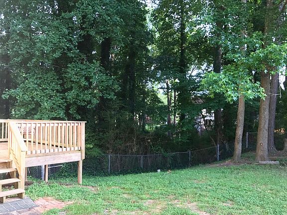 fenced-in backyard with deck