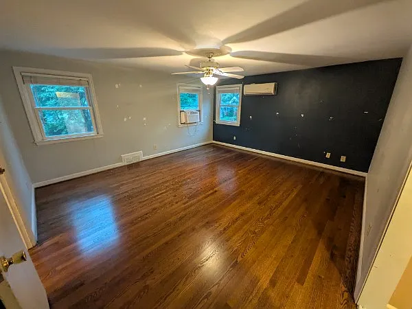 Larger Upstairs bedroom (west) viewed from entrance to walk-in closet.
