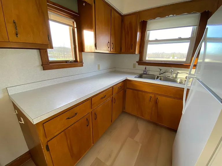 Kitchen with restored cabinets and pristine, vintage countertop