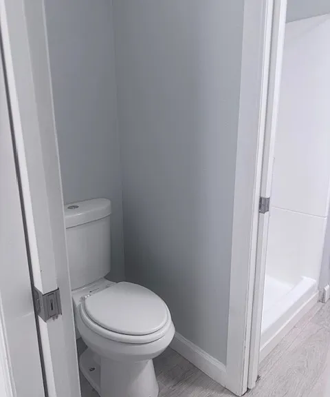 toilet area is jack and jill between the two sink and shower areas