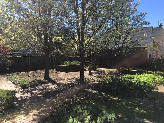 Sun room looks out to charming private garden