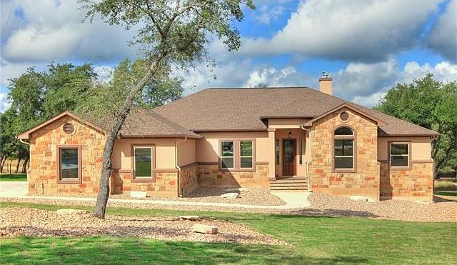 Stunning home complete with Front and Back Sod, professionally landscaped with Full Gutters!