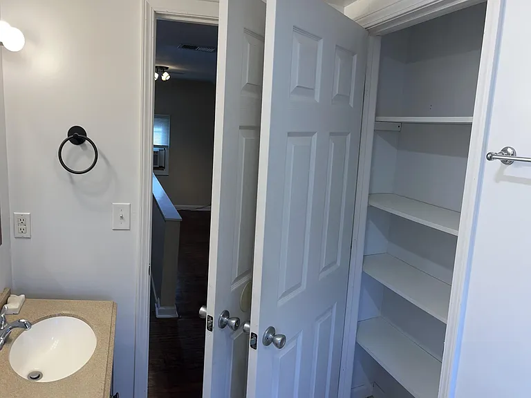 Second floor bath, view 2 - ample linen closet.
