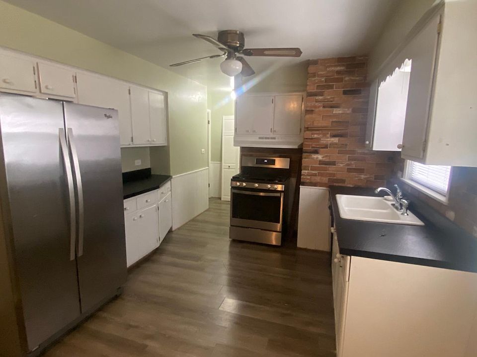 Kitchen - new flooring and stainless steel appliances