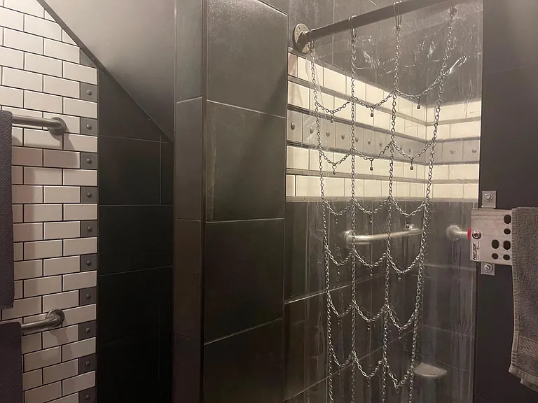 Steampunk Suite custom built walk in shower with subway tiles