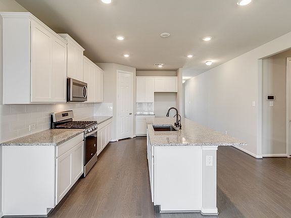 Spacious light and bright kitchen with island and pantry