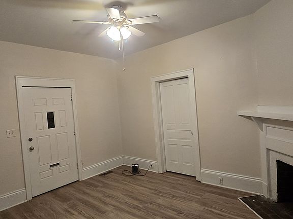 Livingroom, facing the front door (has the small window).