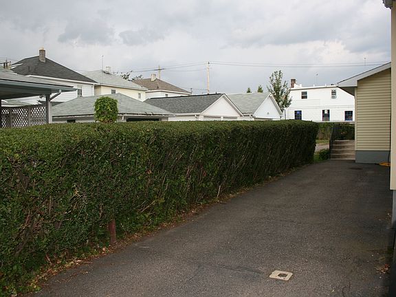 Main parking to the left of house off W Walnut St.