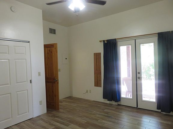 Second bedroom with doors to patio