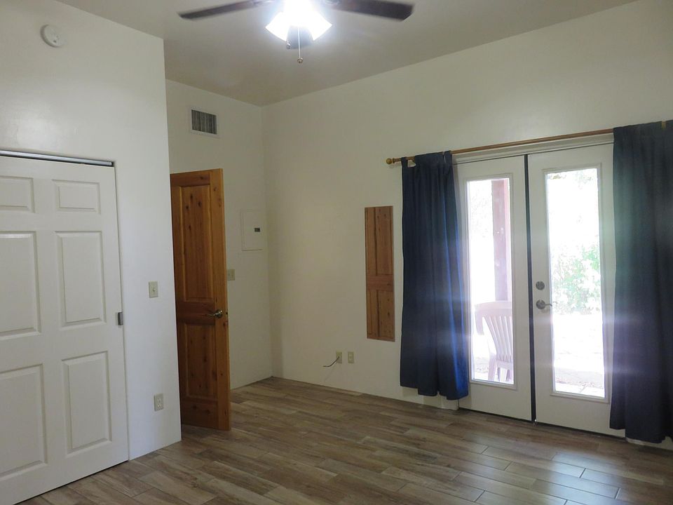 Second bedroom with doors to patio