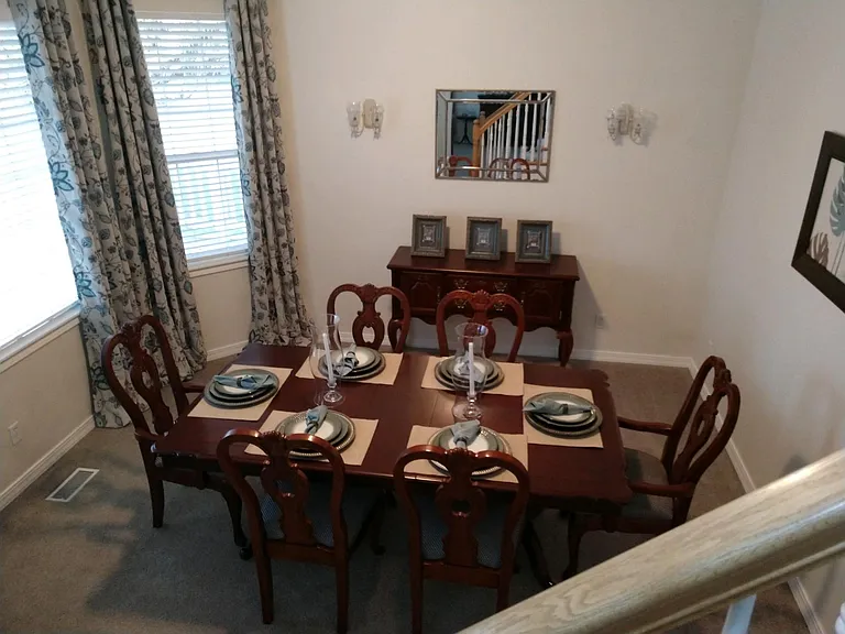 View from staircase of front living room.