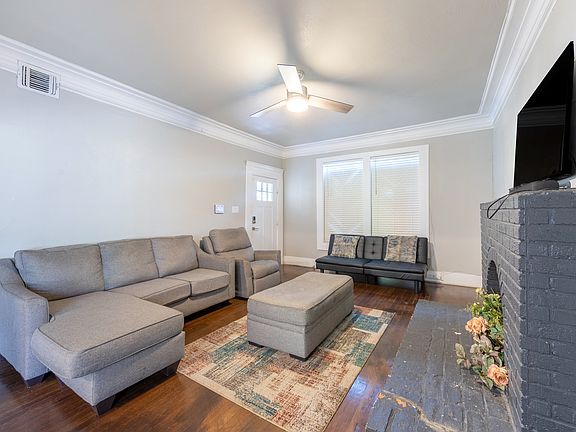 Living room with TV and Sofa and Futon bed.