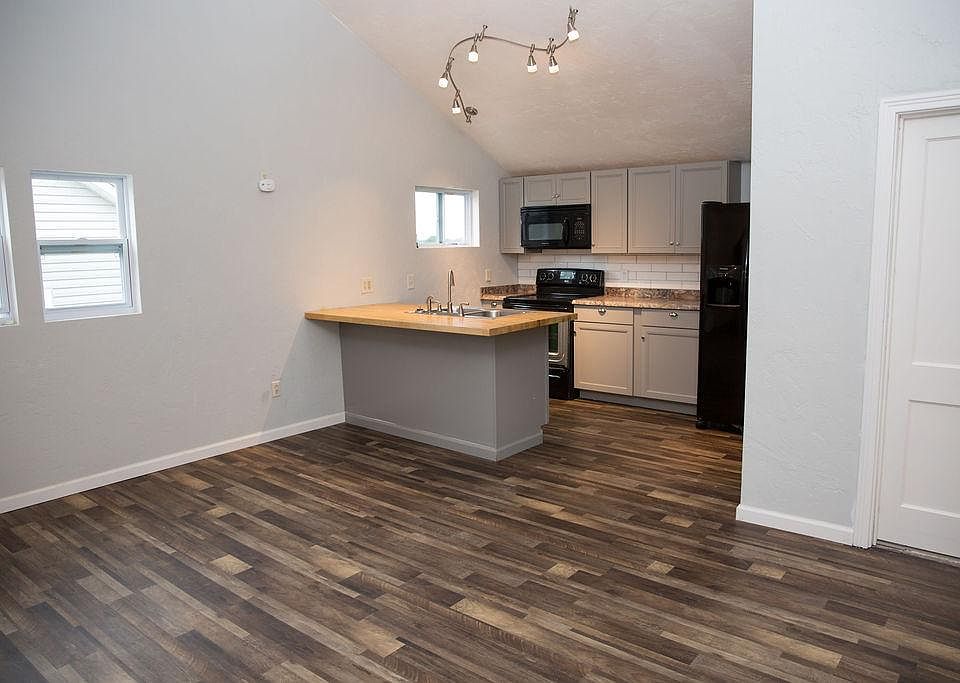 Three stools will fit under the counter