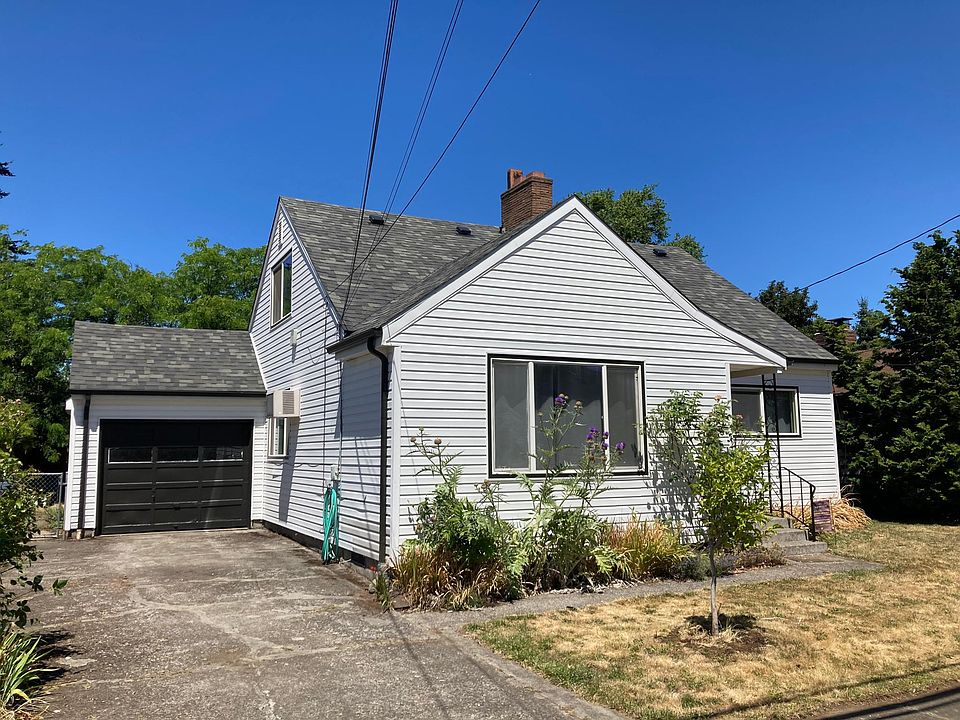 South facing home with detached garage (semi-attached via covered patio off the kitchen).