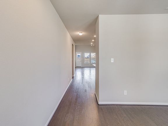 Entryway open to flex room and leading to open concept living area
