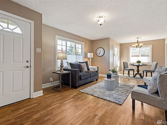 The welcoming entry foyers flows freely into the delightful living room. 