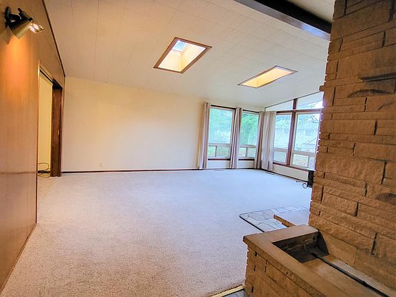 Vaulted ceiling and skylights in living room.