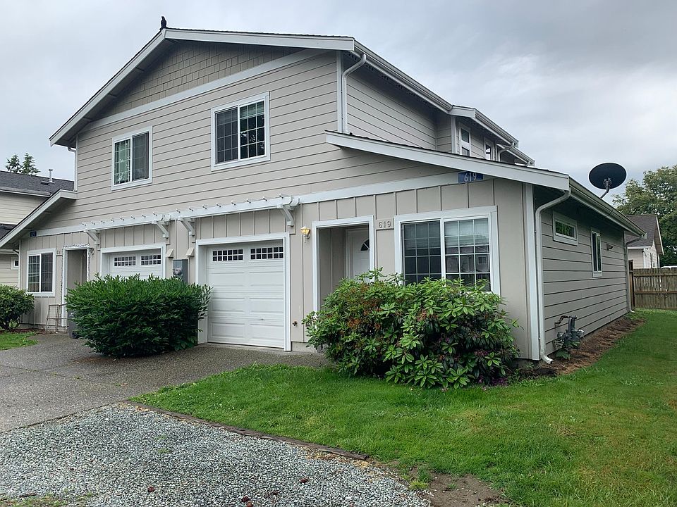 Front of duplex. Single car garage and gravel parking area. Yard care included in rent.