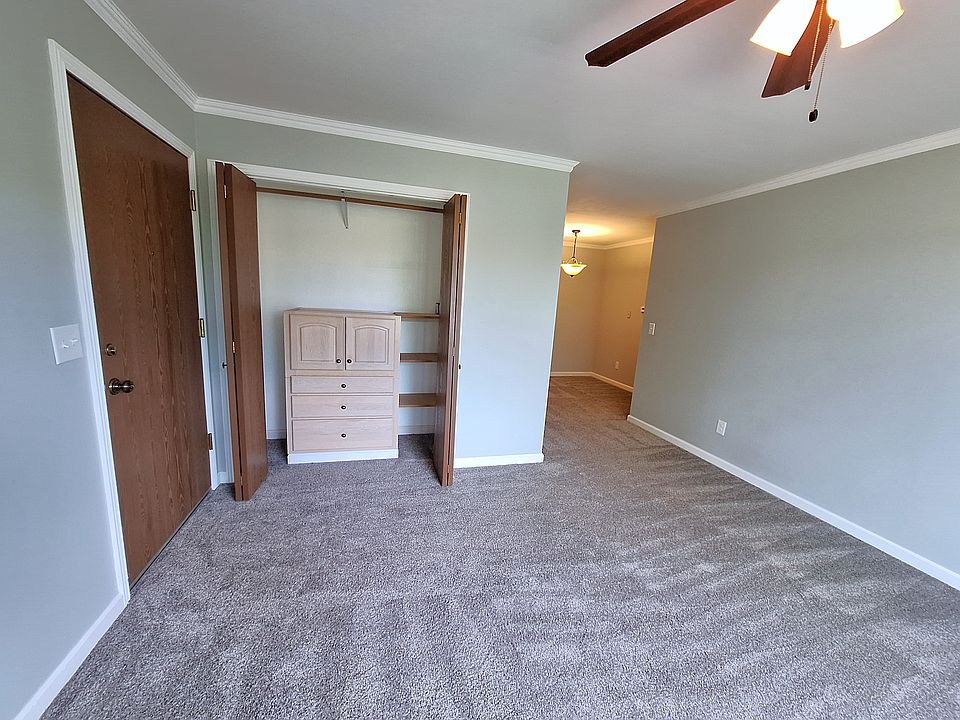 Enter into the living room with large coat closet and built-in organizer.