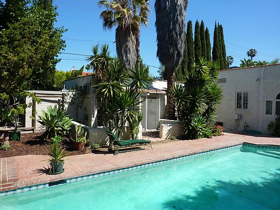 Refreshing swimming pool steps from your front door to take a dip or sit back and enjoy the view!