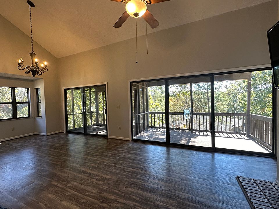 Open living area with screened in porch and balcony