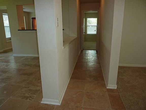 Hallway with den on left and study on the right