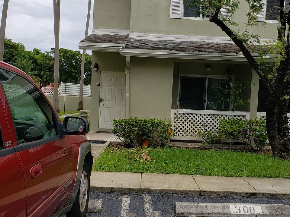 Front of Unit, and designated parking space is directly in front of the front door where the red SUV is parked.