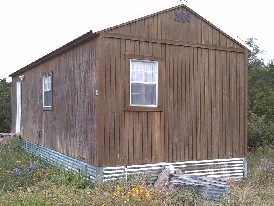 Plain outside, nice inside, yard looks unmowed because we were letting the wildflowers seed out.