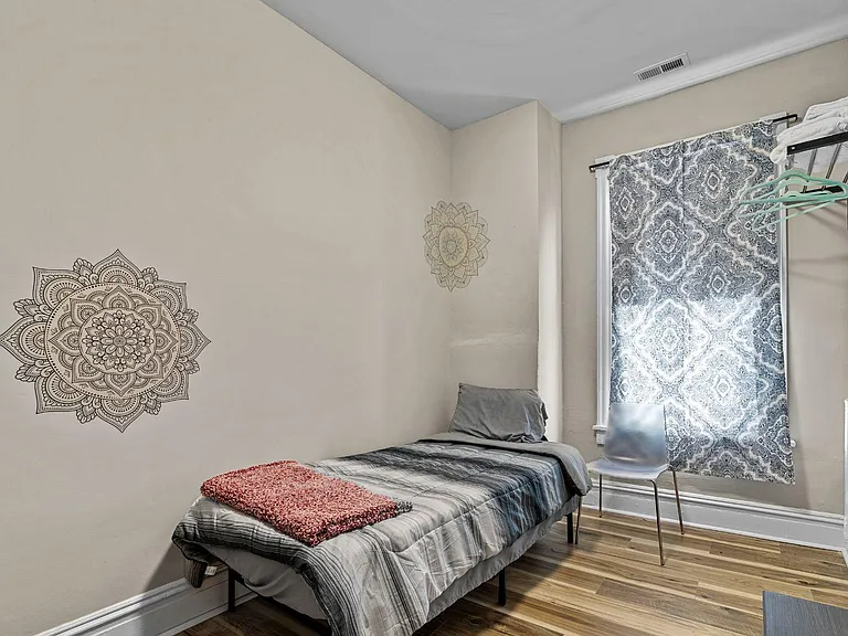 This room is across from bathroom three with a walk in closet.All rooms have extra shelving for storage and clothing.