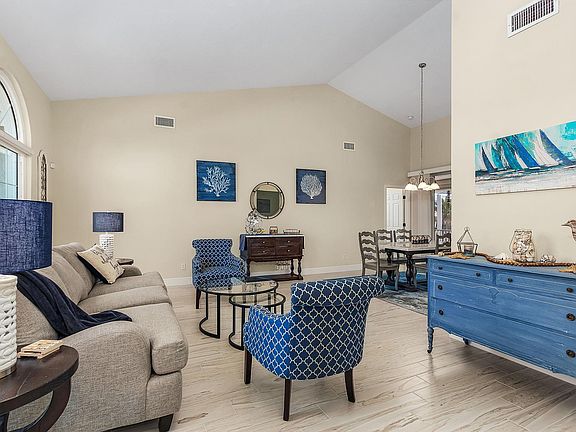 Open layout with living room and adjacent dining rm