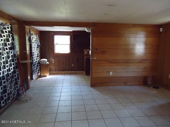 LIVING ROOM WITH TILE FLOORS