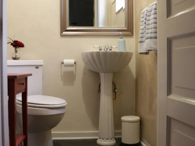Half bathroom off main bedroom