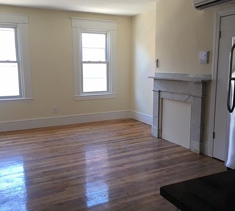 Bright Living Area with Decorative Fireplace