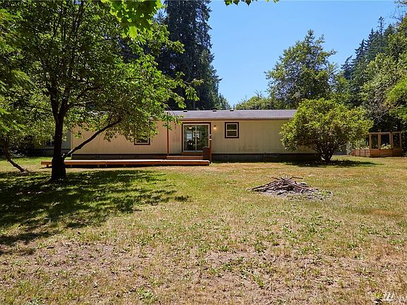 Nice large back yard with fire pit, cherry, apple and pear trees. 