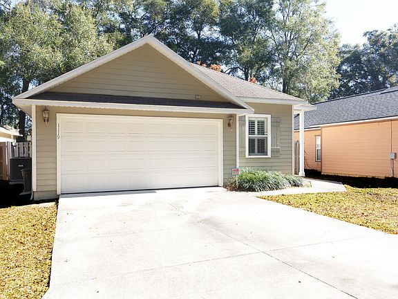 Nice sized two car garage with space outside for another two cars in the driveway.