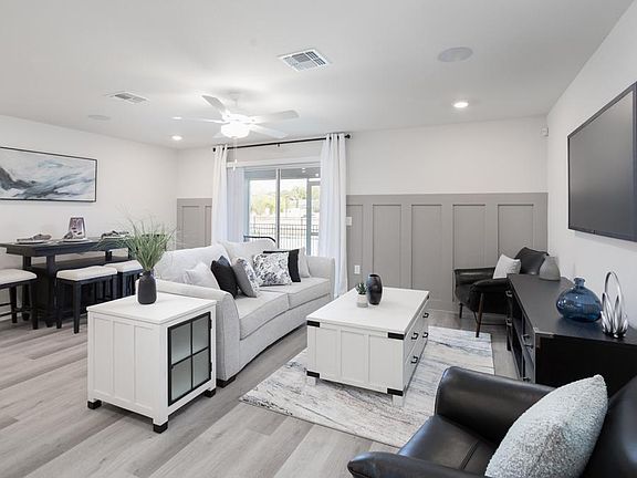 The versatile open-concept living space allows for a dining table if you so desire - Azalea townhome