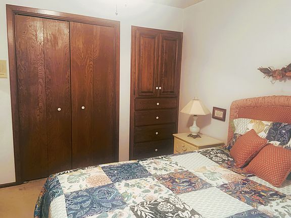 Closet plus built in shelves and drawers. There is an armoire on the opposite wall.