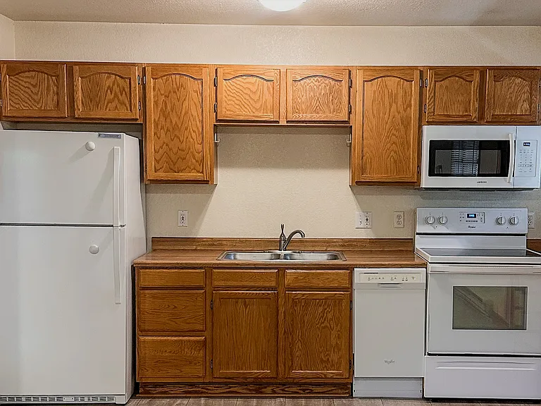 Full kitchen with generous cabinet space, modern appliances, and room for everyday cooking.
