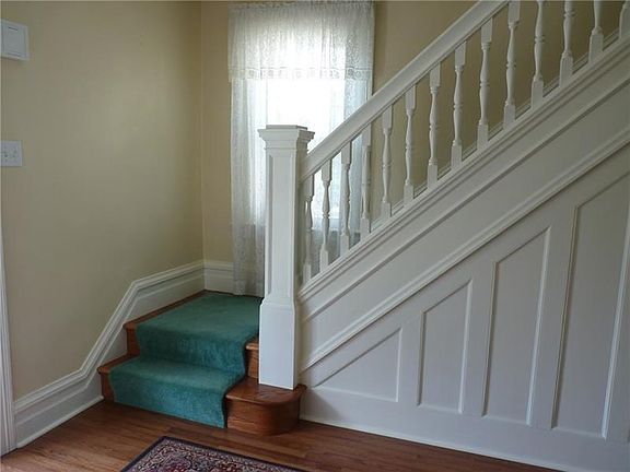 Entry with hardwood floor and stairs