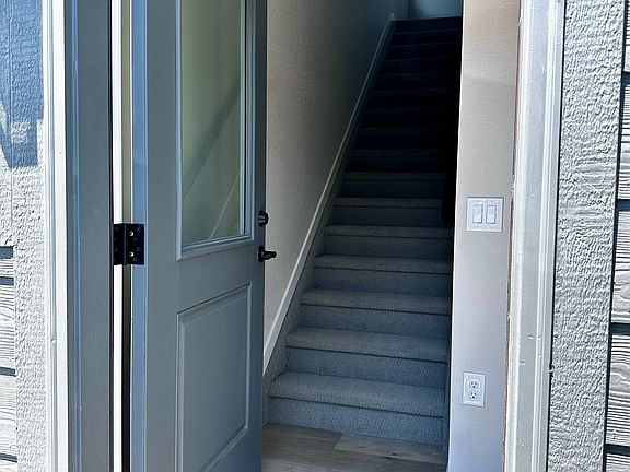 Stairs up into unit.