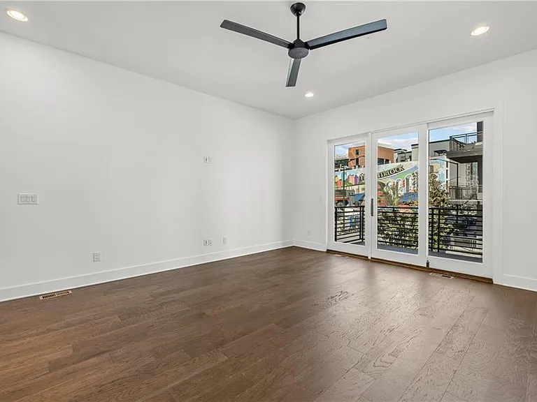 Living Room (Note: Actual unit has light wooden floors and upgraded fixtures / appliances)