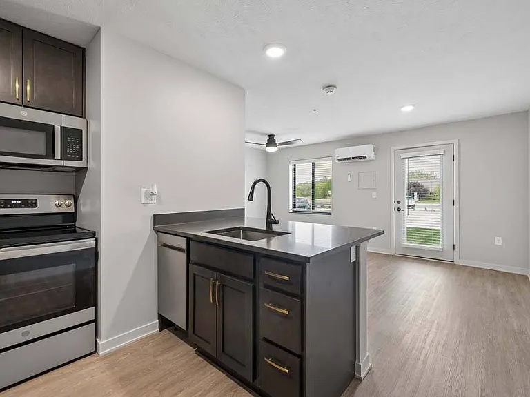 The heart of the home, this contemporary kitchen opens effortlessly to the living area for easy entertaining and everyday comfort.