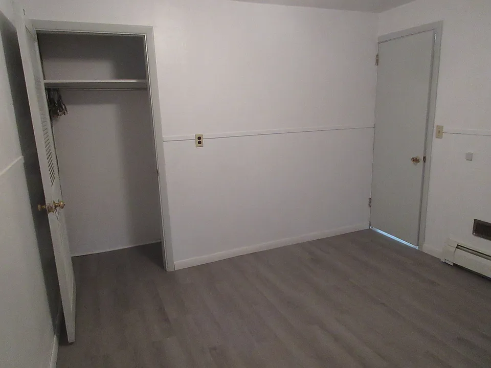 first bedroom (11 x 12) with door to living room