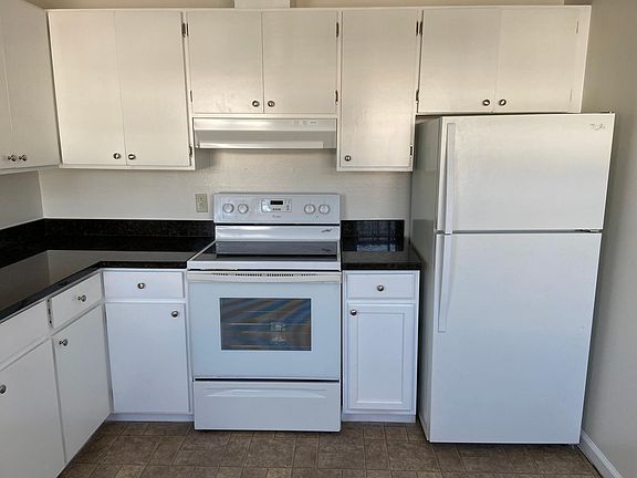 Newly painted cabinets with new knobs.